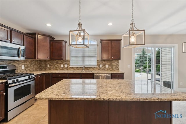 4382 Morgan Pl, Perrysburg, OH 43551 - kitchen with appliances with stainless steel finishes, light tile patterned flooring, tasteful backsplash, and recessed lighting
