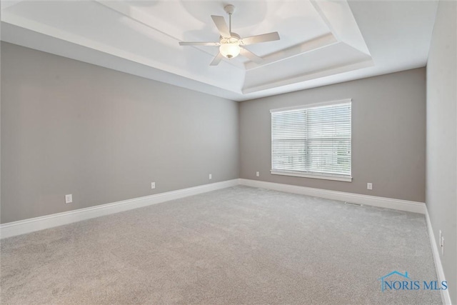4382 Morgan Pl, Perrysburg, OH 43551 - empty room with a raised ceiling, carpet, and ceiling fan
