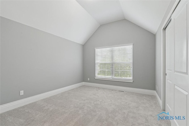 4382 Morgan Pl, Perrysburg, OH 43551 - unfurnished bedroom with vaulted ceiling, carpet flooring, and a closet