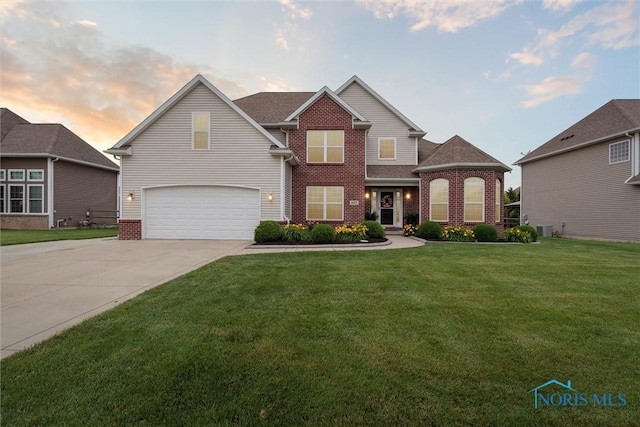 4382 Morgan Pl, Perrysburg, OH 43551 - traditional-style house with a garage, driveway, brick siding, a yard, and a shingled roof