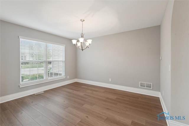 4382 Morgan Pl, Perrysburg, OH 43551 - empty room featuring a chandelier and wood finished floors