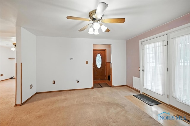 356 S Belmore St, Leipsic, OH 45856 - entrance foyer featuring a ceiling fan and light colored carpet