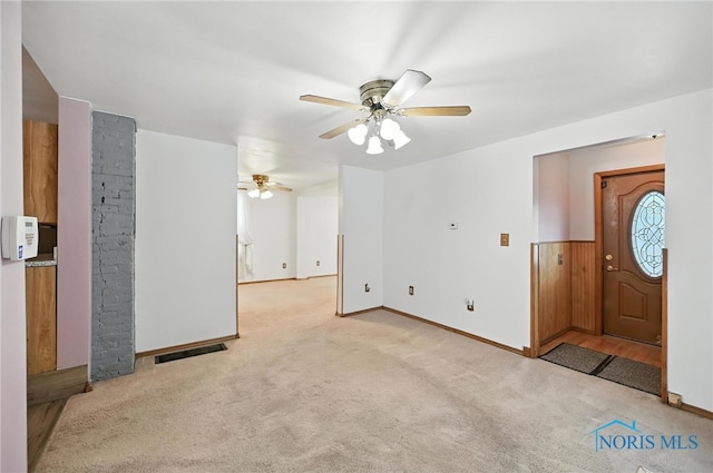 356 S Belmore St, Leipsic, OH 45856 - unfurnished living room with carpet and ceiling fan