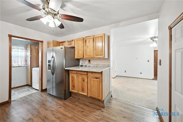 356 S Belmore St, Leipsic, OH 45856 - kitchen featuring stainless steel refrigerator with ice dispenser, ceiling fan, washer / clothes dryer, and light wood-type flooring