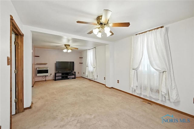 356 S Belmore St, Leipsic, OH 45856 - unfurnished living room featuring ceiling fan, heating unit, and carpet floors
