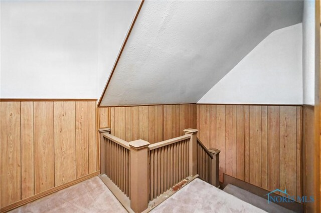 356 S Belmore St, Leipsic, OH 45856 - stairway with lofted ceiling, wood walls, and wainscoting