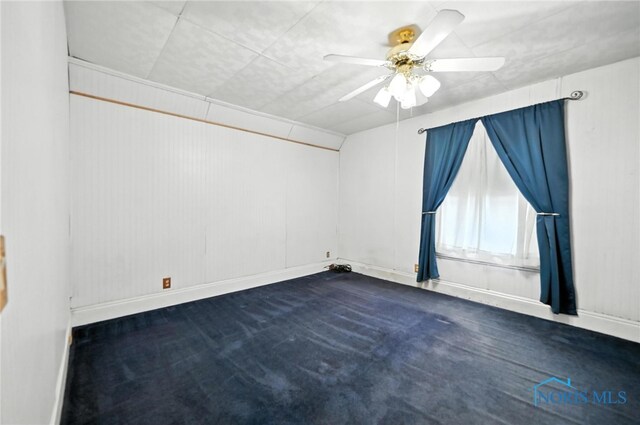 356 S Belmore St, Leipsic, OH 45856 - unfurnished room featuring dark colored carpet and ceiling fan