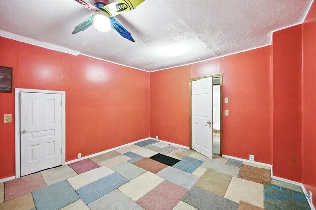 356 S Belmore St, Leipsic, OH 45856 - spare room featuring a ceiling fan and a textured ceiling