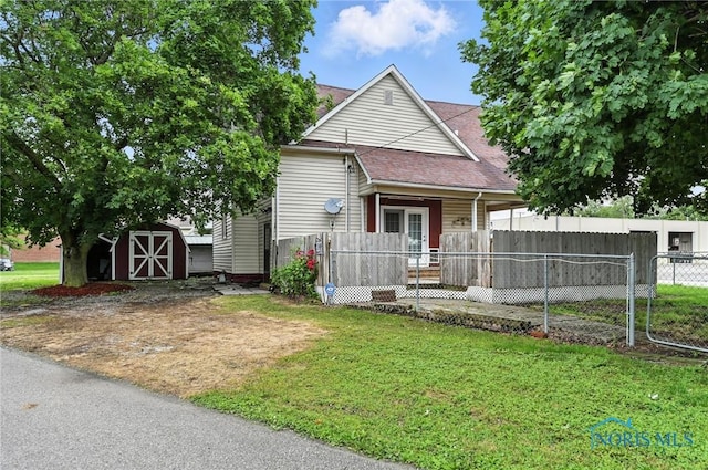 356 S Belmore St, Leipsic, OH 45856 - view of front of home featuring a shed and a shingled roof