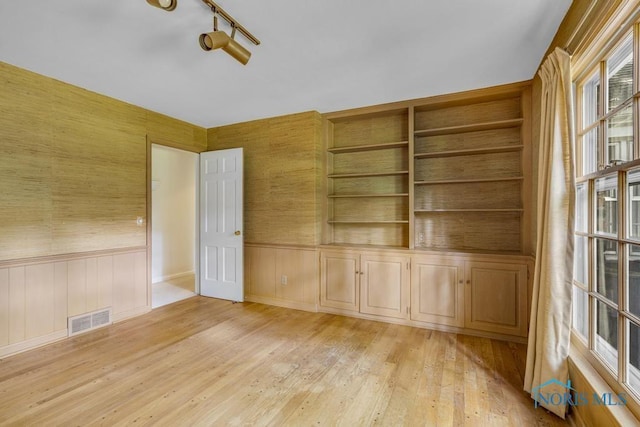 3432 Corey Rd, Toledo, OH 43615 - unfurnished room with light wood-style floors and a wainscoted wall