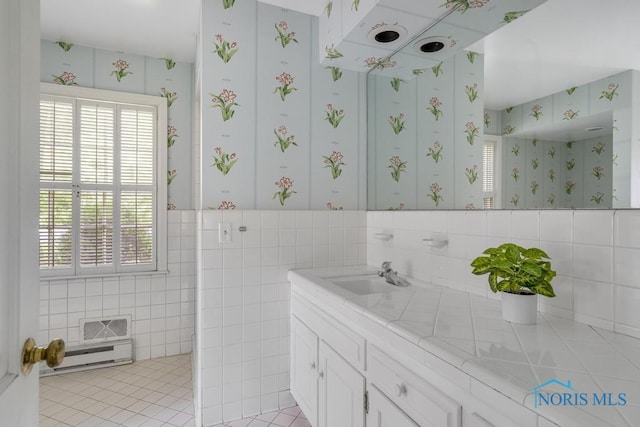 3432 Corey Rd, Toledo, OH 43615 - bathroom featuring wallpapered walls, vanity, healthy amount of natural light, tile patterned flooring, and tile walls