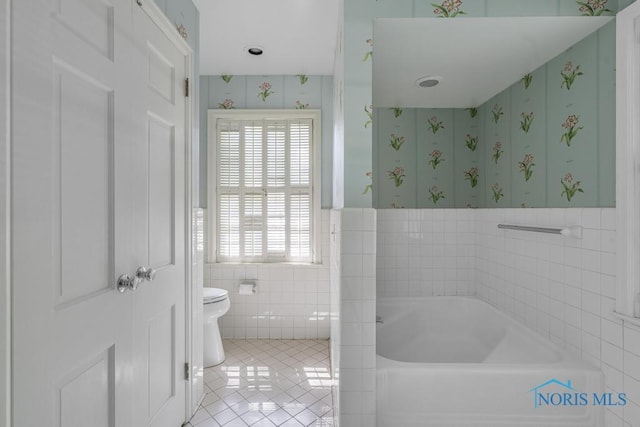 3432 Corey Rd, Toledo, OH 43615 - full bathroom with a garden tub, tile walls, tile patterned flooring, wallpapered walls, and a wainscoted wall