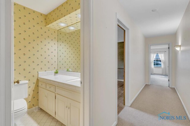 3432 Corey Rd, Toledo, OH 43615 - bathroom featuring wallpapered walls and vanity