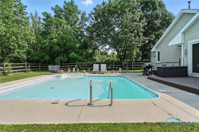 1780 Lexington Dr, Perrysburg, OH 43551 - view of swimming pool featuring a fenced backyard, a deck, a grill, view of scattered trees, and a patio