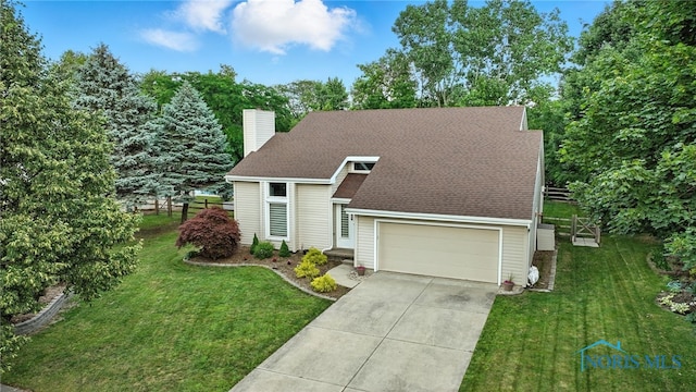 1780 Lexington Dr, Perrysburg, OH 43551 - view of front facade with a chimney, concrete driveway, a front yard, and an attached garage