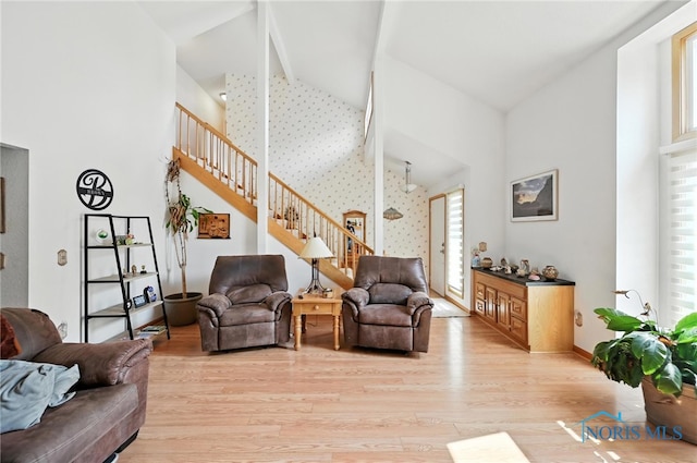 1780 Lexington Dr, Perrysburg, OH 43551 - living area with high vaulted ceiling, light wood-type flooring, stairway, and beam ceiling