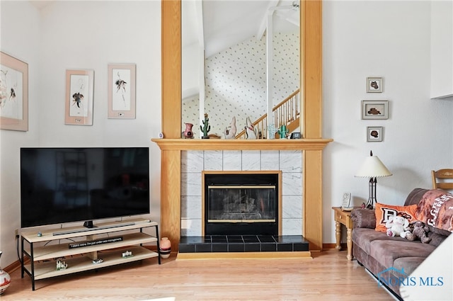 1780 Lexington Dr, Perrysburg, OH 43551 - living area featuring wood finished floors, a fireplace, and high vaulted ceiling