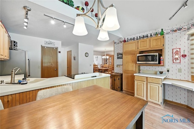 1780 Lexington Dr, Perrysburg, OH 43551 - kitchen with stainless steel appliances, rail lighting, light wood finished floors, a chandelier, and wallpapered walls