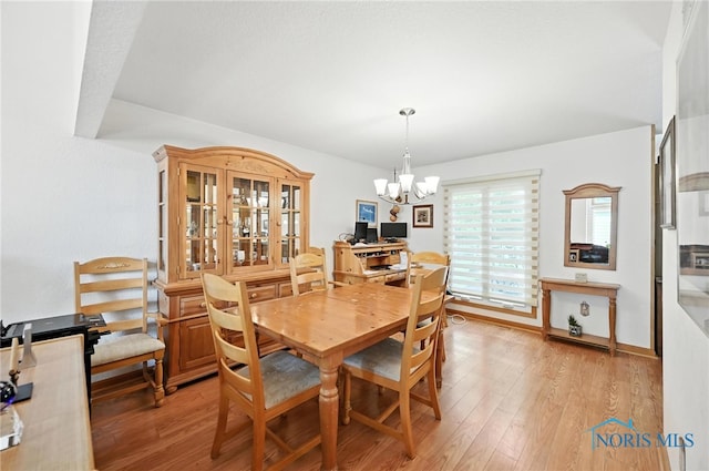 1780 Lexington Dr, Perrysburg, OH 43551 - dining area featuring a chandelier and light wood-style floors