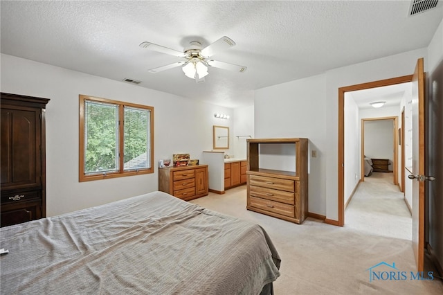 1780 Lexington Dr, Perrysburg, OH 43551 - bedroom with light colored carpet, a textured ceiling, a ceiling fan, and ensuite bath