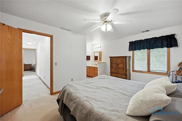 1780 Lexington Dr, Perrysburg, OH 43551 - bedroom featuring light colored carpet, ensuite bath, ceiling fan, and a textured ceiling