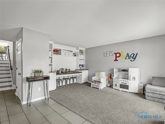 5425 Tulane Ave, Toledo, OH 43611 - living room with stairs and a textured ceiling