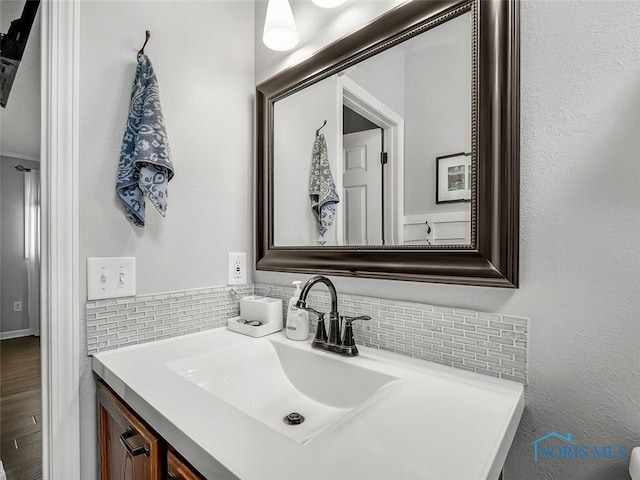 5425 Tulane Ave, Toledo, OH 43611 - bathroom featuring vanity and tasteful backsplash