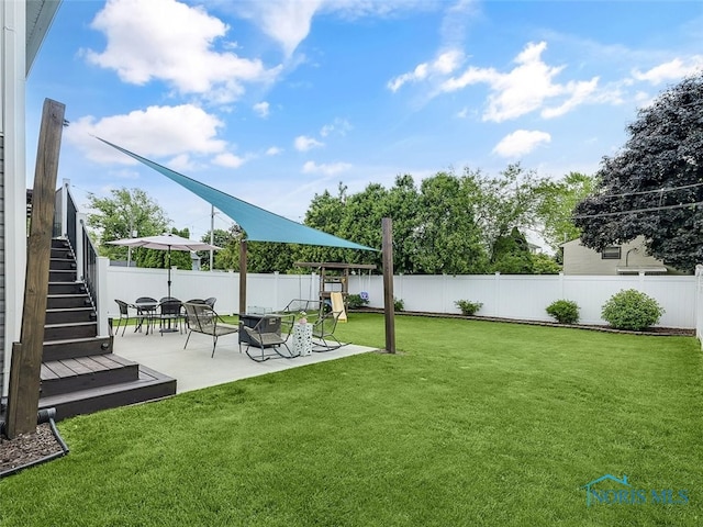 5425 Tulane Ave, Toledo, OH 43611 - fenced backyard featuring a patio and stairway