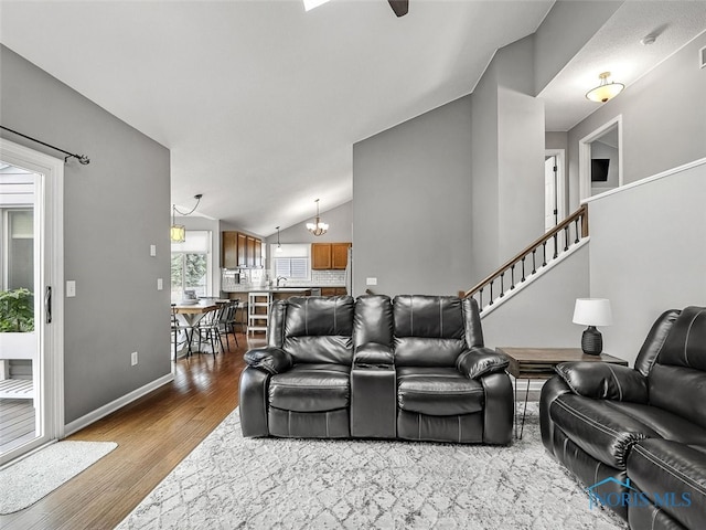 5425 Tulane Ave, Toledo, OH 43611 - living area with dark wood-style flooring and vaulted ceiling