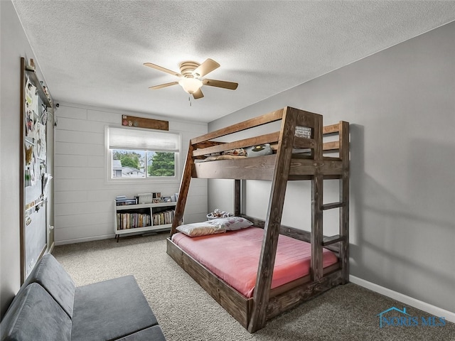 5425 Tulane Ave, Toledo, OH 43611 - carpeted bedroom featuring a textured ceiling and a ceiling fan
