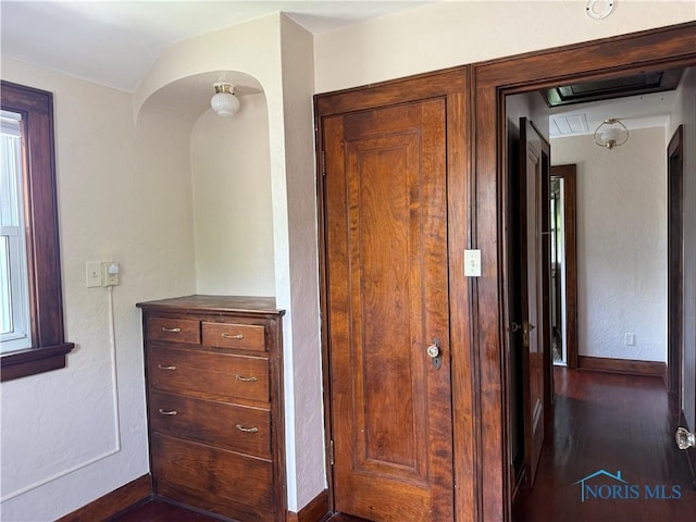 733 Mayfair Blvd, Toledo, OH 43612 - hall featuring arched walkways, dark wood-style flooring, and attic access
