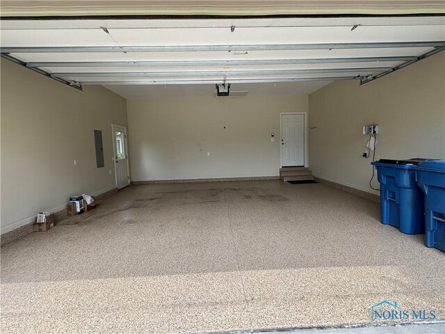 5346 Palisades Dr, Sylvania, OH 43560 - garage featuring electric panel and a garage door opener