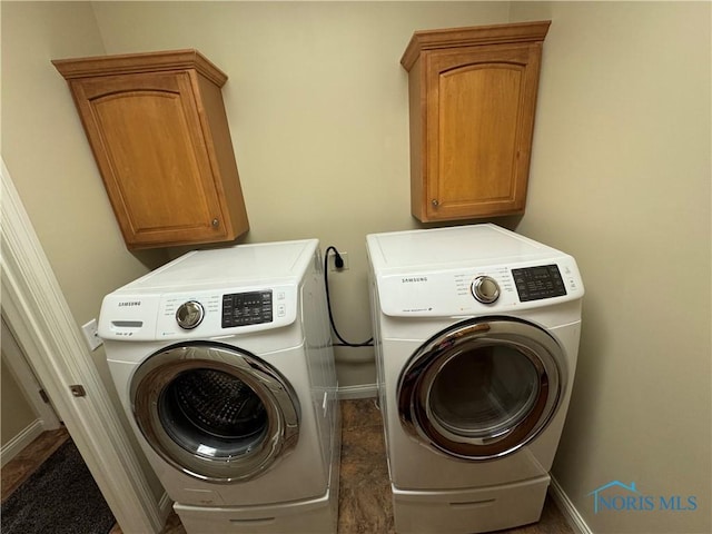5346 Palisades Dr, Sylvania, OH 43560 - laundry area with washer and dryer and cabinet space