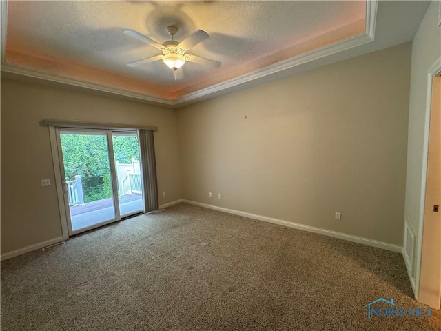 5346 Palisades Dr, Sylvania, OH 43560 - carpeted spare room with a tray ceiling, ceiling fan, and a textured ceiling
