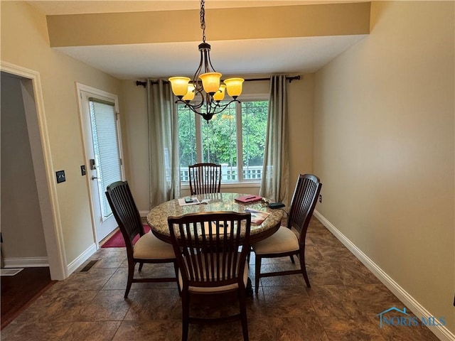 5346 Palisades Dr, Sylvania, OH 43560 - dining space featuring a chandelier and baseboards