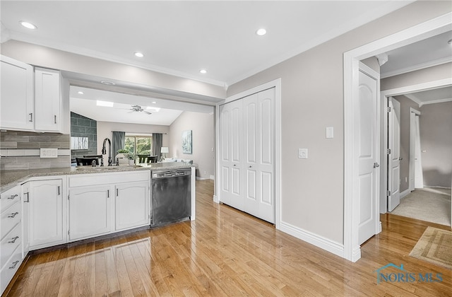 11 Meadowpond Dr, Perrysburg, OH 43551 - kitchen featuring dishwashing machine, light wood-type flooring, white cabinetry, a peninsula, and ornamental molding