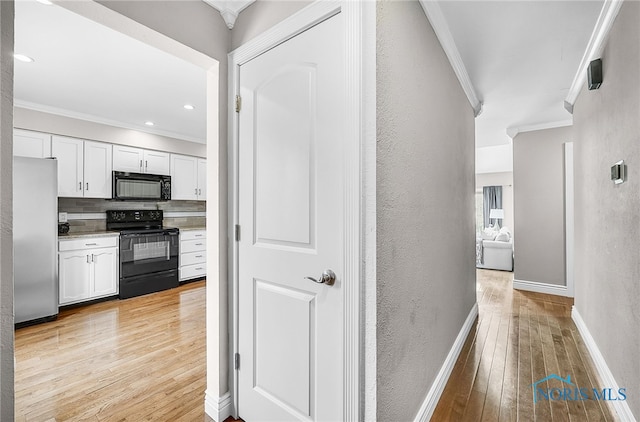 11 Meadowpond Dr, Perrysburg, OH 43551 - hall with ornamental molding, light wood-style floors, and a textured wall