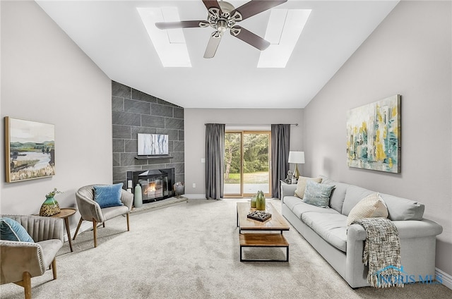 11 Meadowpond Dr, Perrysburg, OH 43551 - carpeted living area with a skylight, high vaulted ceiling, ceiling fan, and a tile fireplace