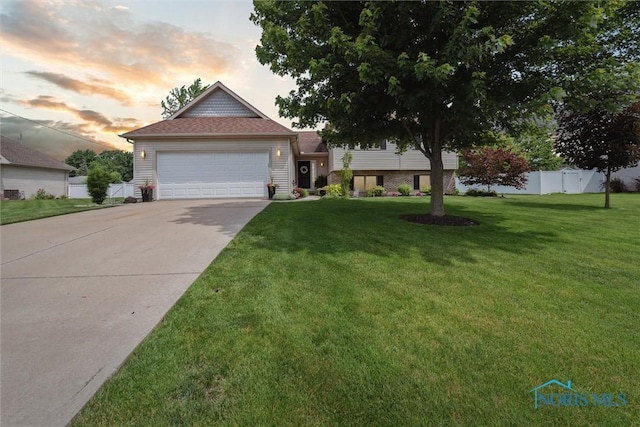 735 Hemlock St, Wauseon, OH 43567 - tri-level home with concrete driveway and a garage