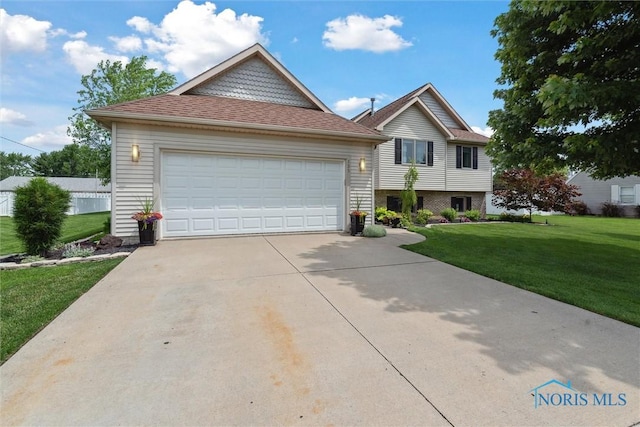 735 Hemlock St, Wauseon, OH 43567 - view of front of property with a front yard and driveway