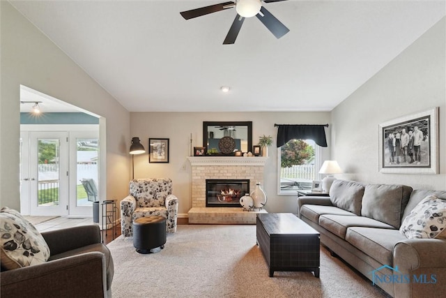735 Hemlock St, Wauseon, OH 43567 - living room with healthy amount of natural light, a fireplace, carpet flooring, and ceiling fan