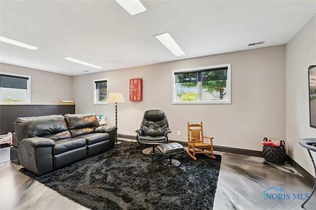 735 Hemlock St, Wauseon, OH 43567 - living area with healthy amount of natural light and concrete floors
