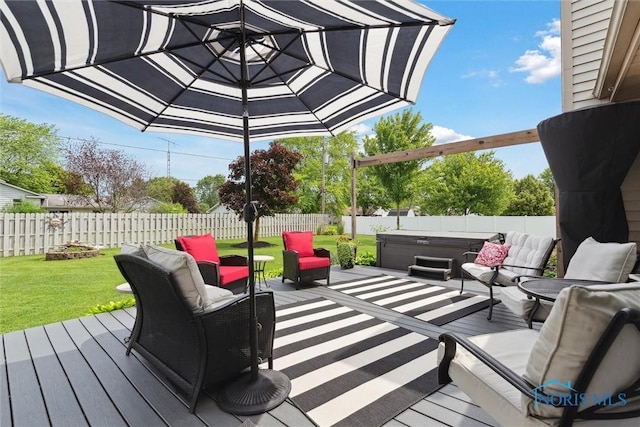 735 Hemlock St, Wauseon, OH 43567 - wooden deck with a hot tub, a fenced backyard, and an outdoor living space