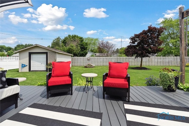735 Hemlock St, Wauseon, OH 43567 - wooden terrace featuring a fenced backyard and a storage shed