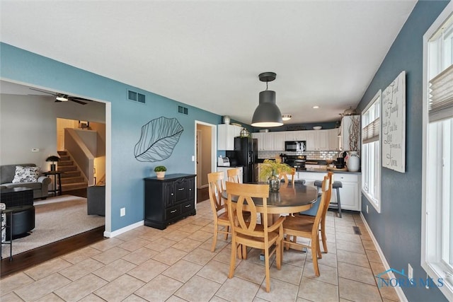 735 Hemlock St, Wauseon, OH 43567 - dining area featuring plenty of natural light, stairway, a ceiling fan, light tile patterned floors, and recessed lighting