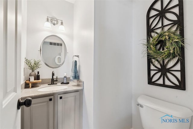 735 Hemlock St, Wauseon, OH 43567 - bathroom featuring vanity and toilet