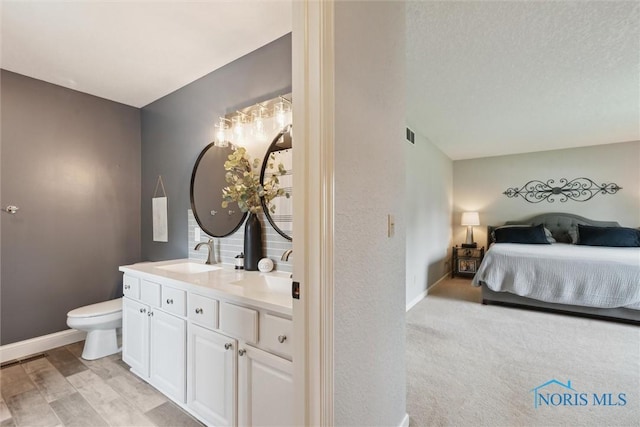 735 Hemlock St, Wauseon, OH 43567 - bedroom featuring a sink and baseboards