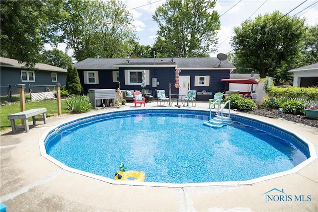1118 5th St, Findlay, OH 45840 - view of pool with a patio area and an outdoor hangout area