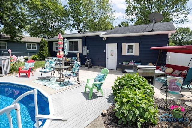 1118 5th St, Findlay, OH 45840 - rear view of house featuring an outdoor pool, a deck, an outdoor living space, and a patio