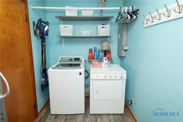 1118 5th St, Findlay, OH 45840 - laundry room featuring washer and dryer and wood finished floors